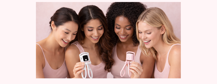 Group of women holding a heated eyelash curler for natural lash styling